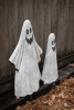 SET OF TWO PAINTED METAL GHOSTS