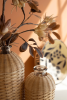 SET OF FOUR RATTAN WRAPPED GLASS VASES