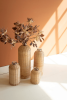 SET OF FOUR RATTAN WRAPPED GLASS VASES