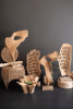CARVED TEAK WOOD SCUPLTURE ON A BASE - PERFORATED