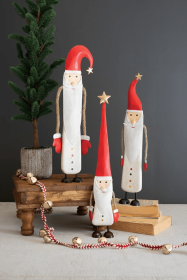 SET OF THREE PAINTED METAL AND WOOD SANTAS